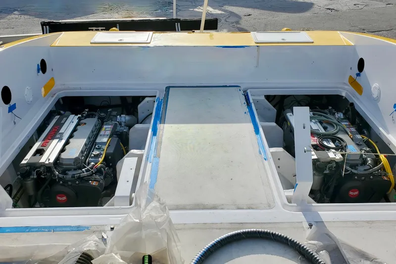  Yacht Photos Pics 2005 Thriller Powerboats Super Cat 55 engine compartment with dual engines visible.