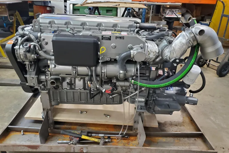  Yacht Photos Pics Engine of a 2005 Thriller Powerboats Super Cat 55, displayed in a workshop setting.