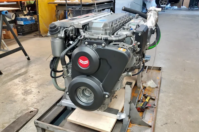  Yacht Photos Pics 2005 Thriller Powerboats Super Cat 55 engine in a workshop setting.