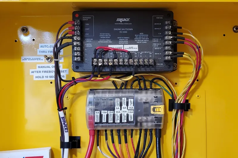  Yacht Photos Pics Electrical panel of a 2005 Thriller Powerboats Super Cat 55, featuring wiring and circuit breakers.
