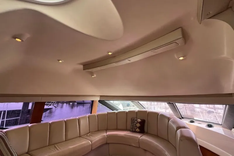 Our Trade Yacht Photos Pics Luxurious interior of 2006 Carver 56 Voyager yacht with plush seating and elegant design.