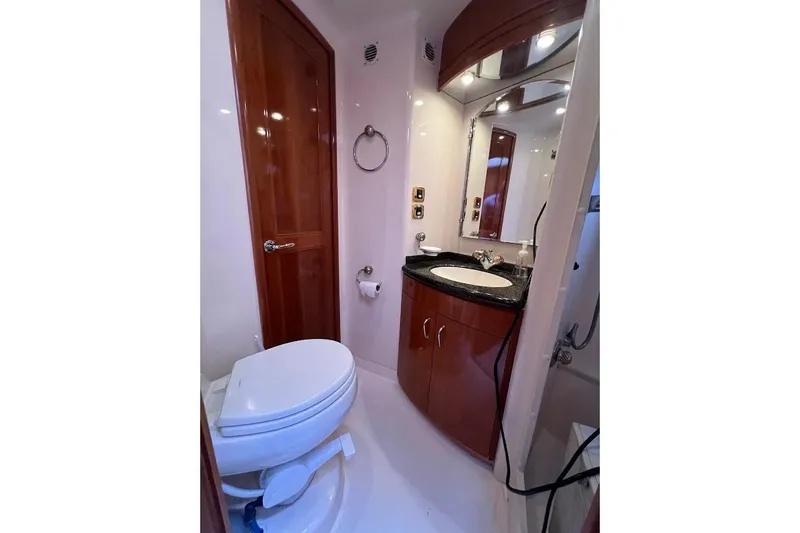 Our Trade Yacht Photos Pics Luxurious bathroom in 2006 Carver 56 Voyager yacht with elegant wood finishes.