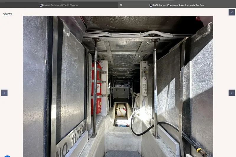 Our Trade Yacht Photos Pics Engine room of 2006 Carver 56 Voyager yacht, featuring equipment and fire extinguishers.