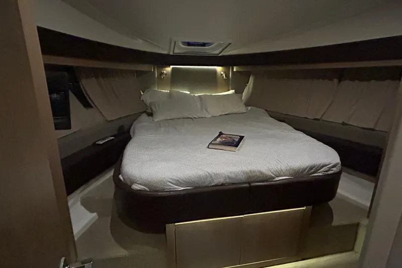  Yacht Photos Pics Luxurious cabin interior of 2016 Sea Ray 400 Sundancer yacht with cozy bed.