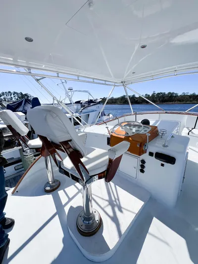 Lb. Cake Yacht Photos Pics 1987 Buddy Davis 61 Convertible yacht helm with dual captain chairs and scenic water view.