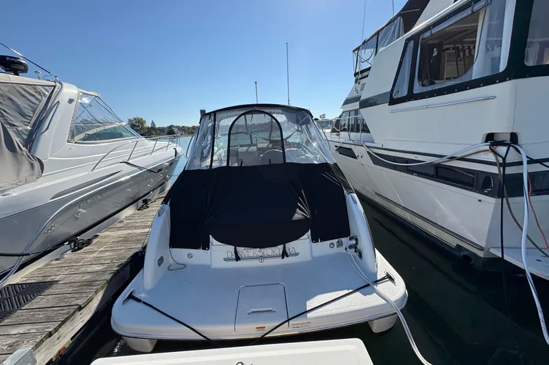 Cool Change Yacht Photos Pics 2008 Formula 350 Sun Sport docked between two boats on a sunny day.