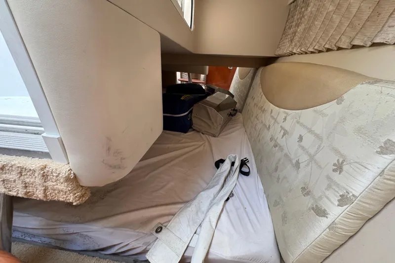 Cool Change Yacht Photos Pics Interior cabin of 2008 Formula 350 Sun Sport with storage and bedding.