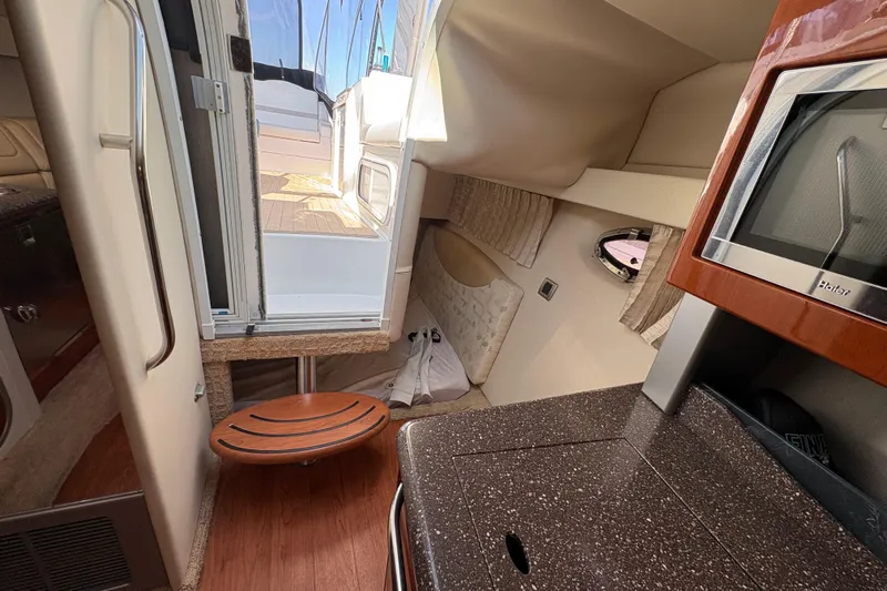 Cool Change Yacht Photos Pics Interior of 2008 Formula 350 Sun Sport boat, featuring kitchenette and cabin access.