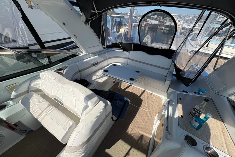 Cool Change Yacht Photos Pics 2008 Formula 350 Sun Sport boat interior with white seating and table, docked at marina.