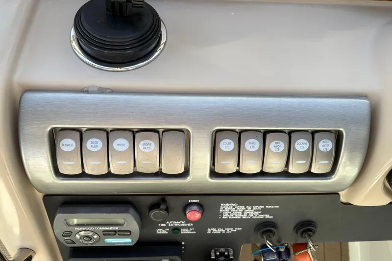 Cool Change Yacht Photos Pics Control panel of a 2008 Formula 350 Sun Sport boat with labeled switches.