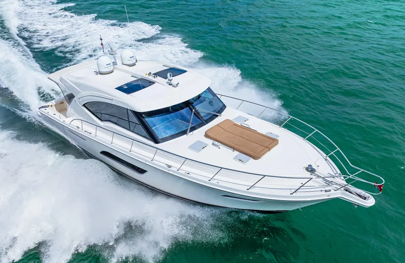 Boa Vida Yacht Photos Pics 2017 Riviera 575 SUV cruising on open water.