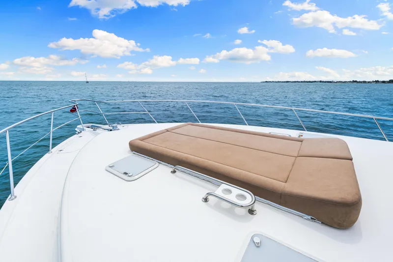 Boa Vida Yacht Photos Pics 2017 Riviera 575 SUV yacht deck with sunbed, ocean view.