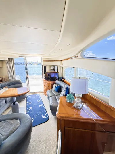 Four Shore Yacht Photos Pics Luxurious interior of a 2002 Azimut 42 yacht with elegant furnishings and ocean view.