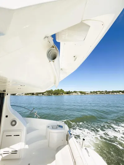 Four Shore Yacht Photos Pics Azimut 42 yacht cruising on a sunny day, 2002 model.