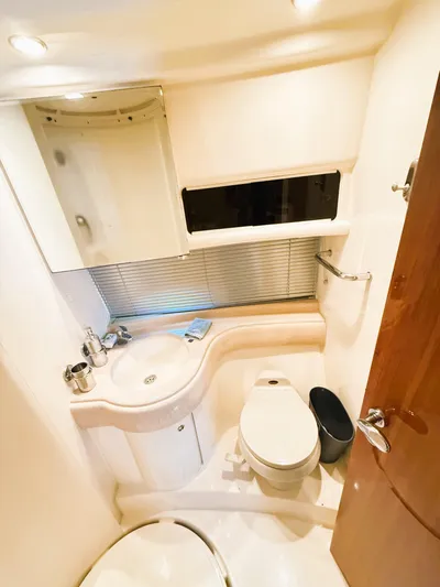 Four Shore Yacht Photos Pics Luxurious bathroom in 2002 Azimut 42 yacht with modern fixtures and elegant design.