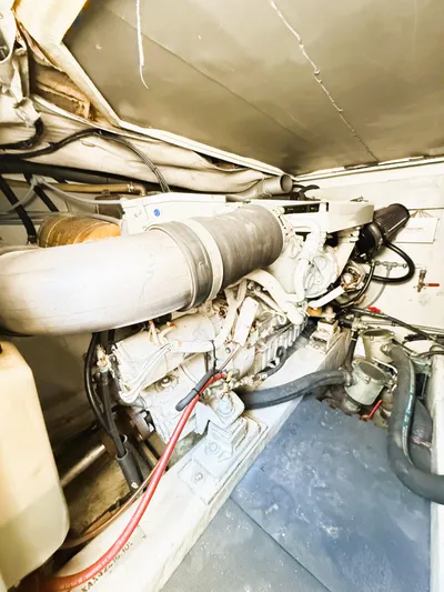 Four Shore Yacht Photos Pics Engine room of a 2002 Azimut 42 yacht, showcasing mechanical components and piping.