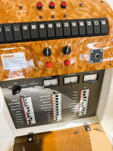 Four Shore Yacht Photos Pics Control panel of a 2002 Azimut 42 yacht with switches and gauges.