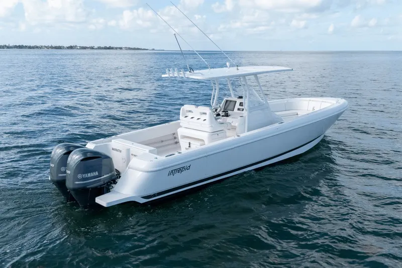  Yacht Photos Pics 2015 Intrepid 327 CC INFUSED boat on open water with Yamaha engines.