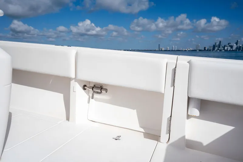  Yacht Photos Pics 2015 Intrepid 327 CC boat interior with ocean and city skyline in background.