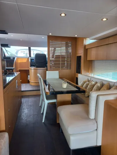  Yacht Photos Pics Luxurious interior of 2017 Fairline Squadron 78 yacht with elegant dining area.