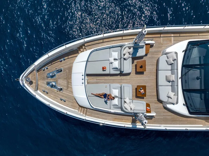 Riviera Living Yacht Photos Pics Aerial view of 2017 Princess 35M yacht with sunbathing area on open sea.
