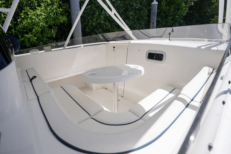 Yacht Photos Pics 2005 Intrepid 348 WA boat interior with white seating and table.