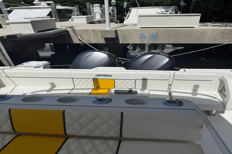  Yacht Photos Pics 2005 Intrepid 348 WA boat with dual engines, docked at a marina.