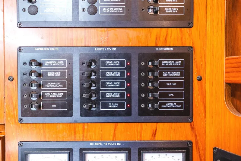  Yacht Photos Pics Control panel of a 2006 Jeanneau Sun Odyssey 49 sailboat, featuring navigation and electronic switches.