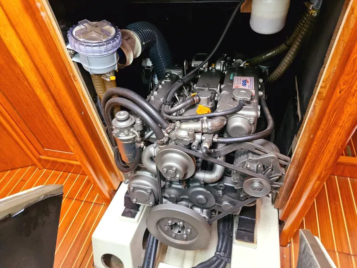 Yacht Photos Pics Engine compartment of a 2006 Jeanneau Sun Odyssey 49 sailboat, showcasing detailed mechanical components.