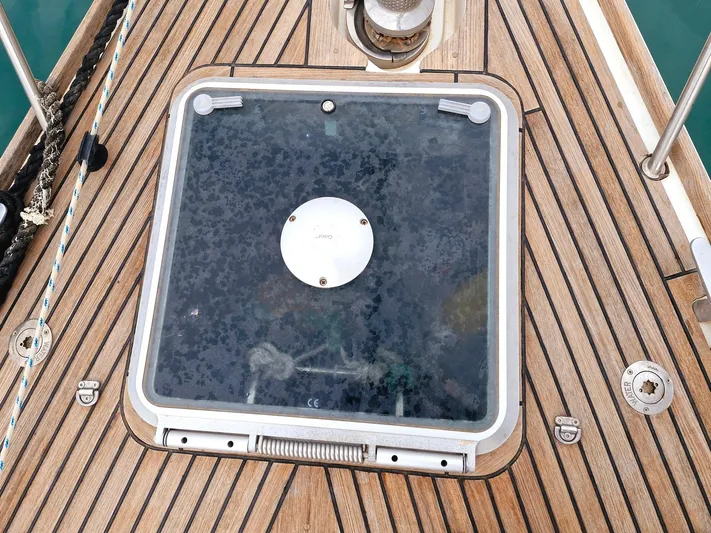  Yacht Photos Pics Deck hatch of 2006 Jeanneau Sun Odyssey 49 sailboat with teak wood finish.