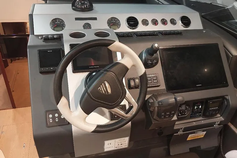 Grata Yacht Photos Pics Cockpit of 2022 Fairline Targa 45 GT yacht with modern navigation controls.