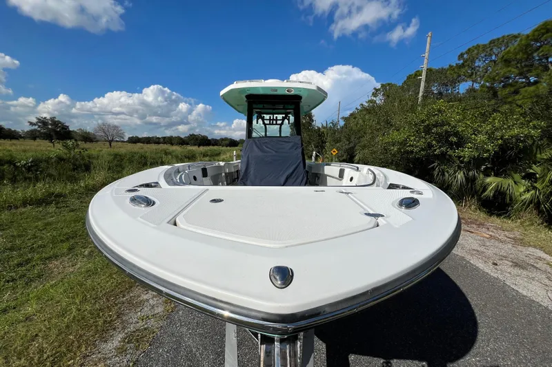  Yacht Photos Pics 2023 Blackfin 272 boat on a sunny day, parked on a rural road.
