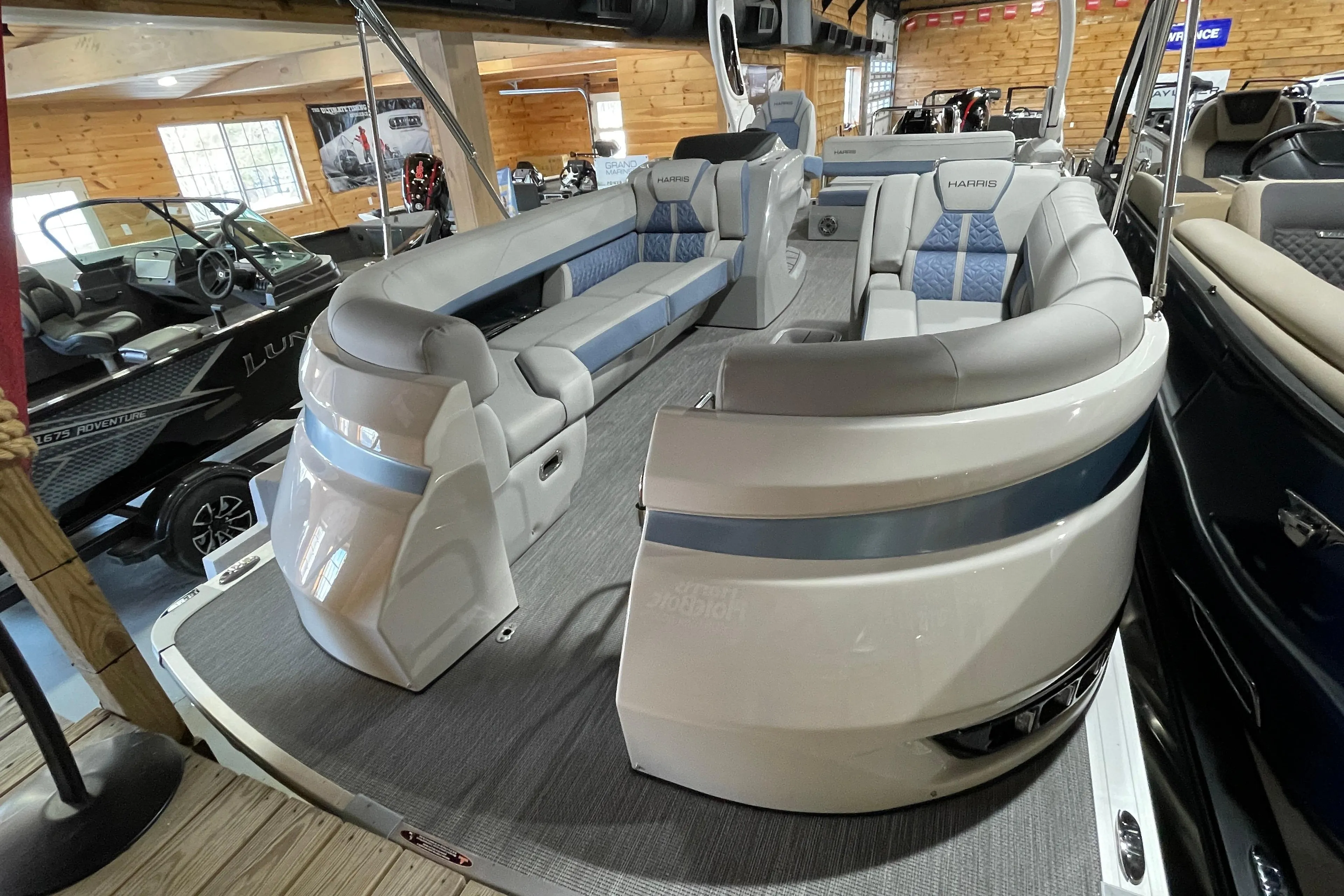 2026 Harris Grand Mariner SEL 250 pontoon boat interior with luxurious seating.