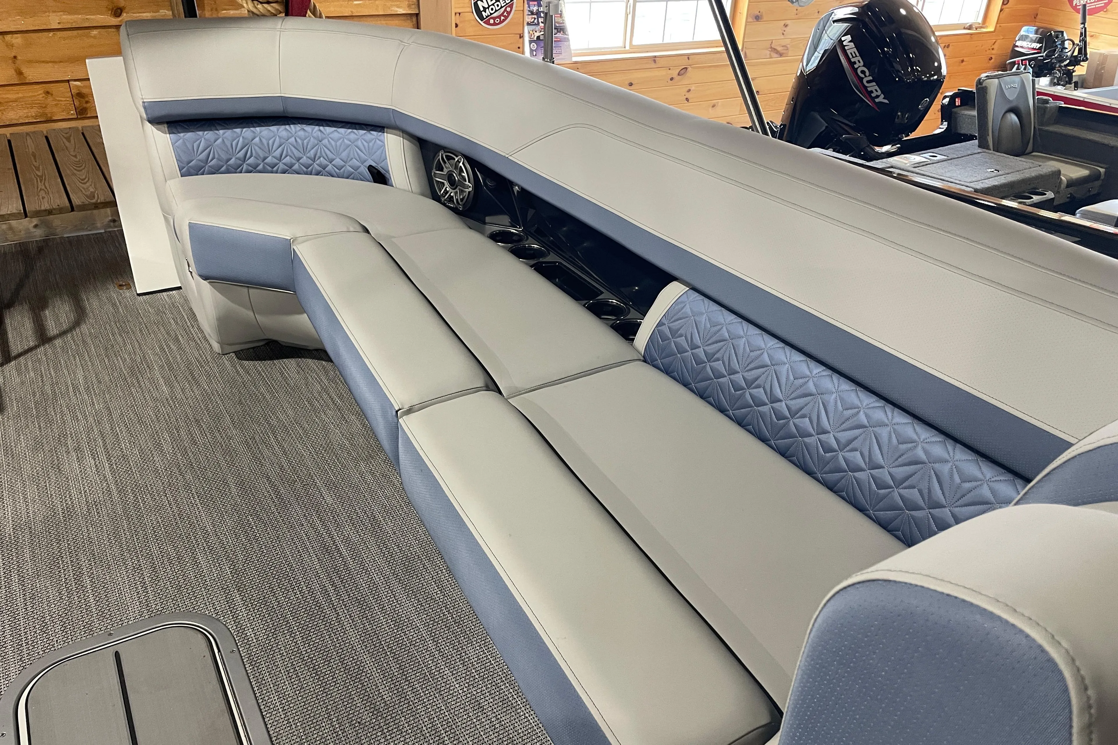 Luxurious seating on 2026 Harris Grand Mariner SEL 250 boat, featuring elegant upholstery and spacious design.