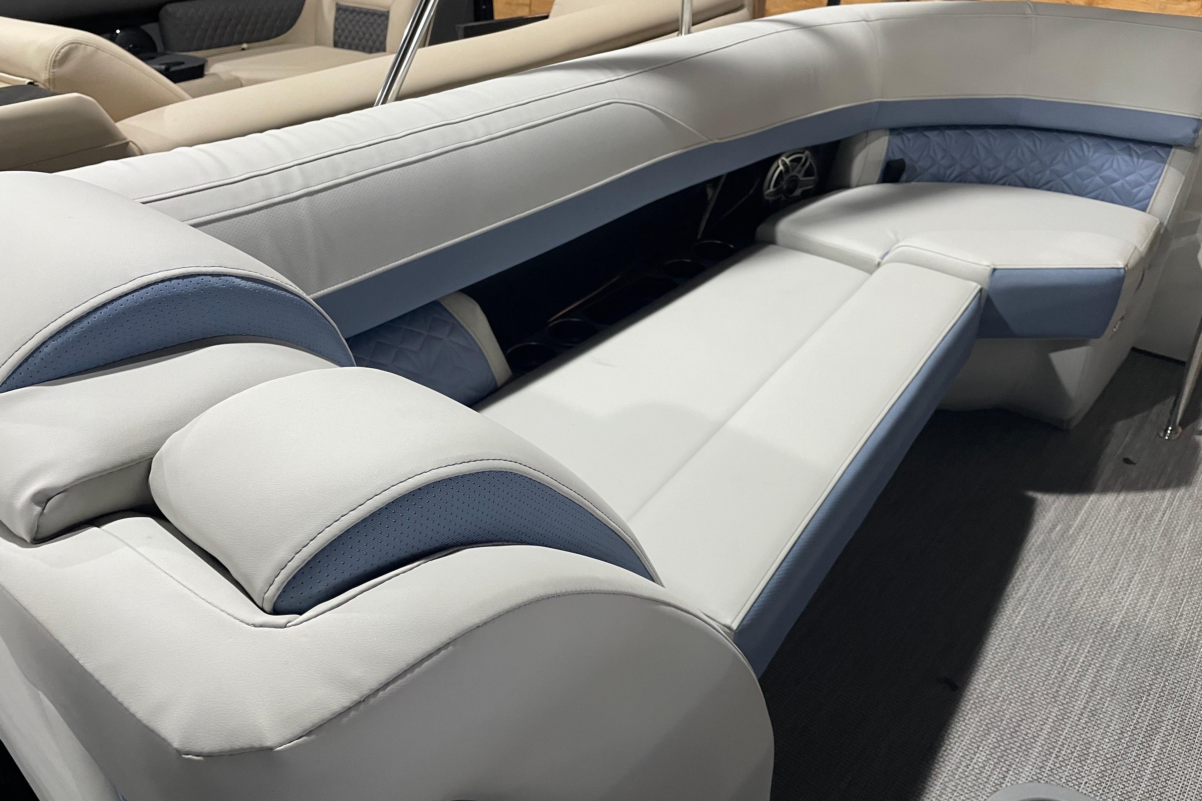 Luxurious seating on 2026 Harris Grand Mariner SEL 250 pontoon boat, featuring elegant upholstery.