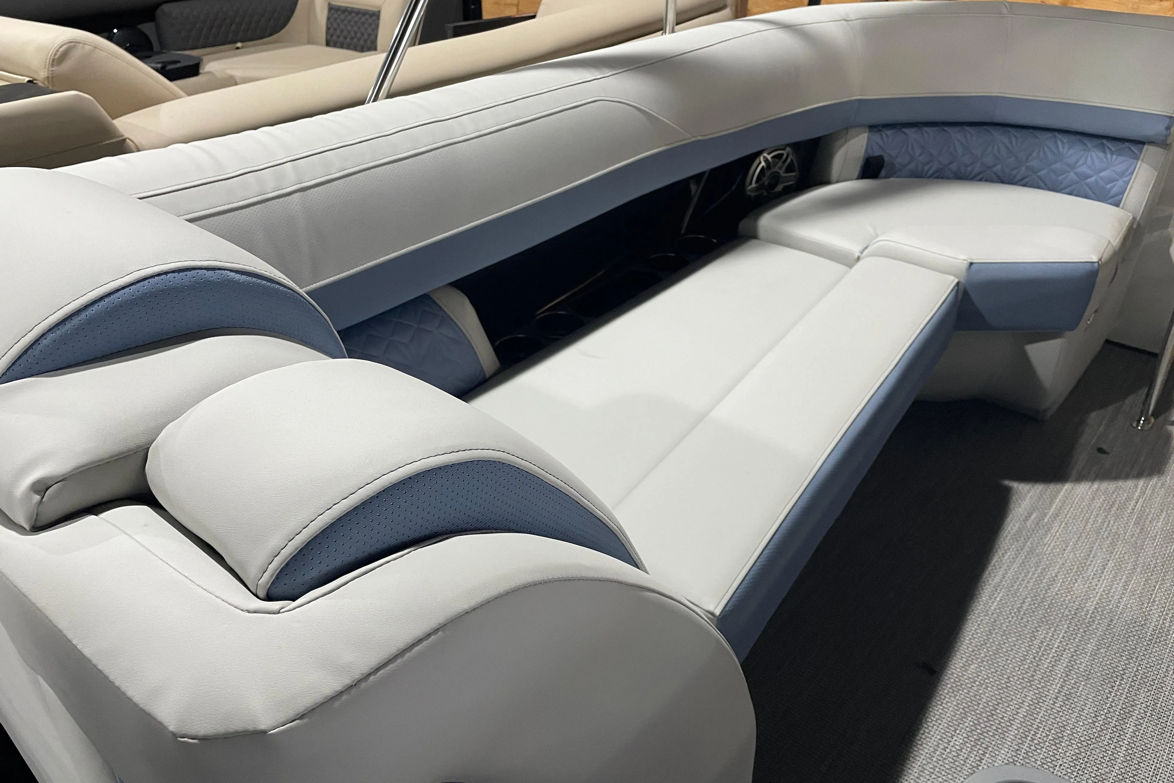 Luxurious seating on 2026 Harris Grand Mariner SEL 250 pontoon boat, featuring elegant upholstery.
