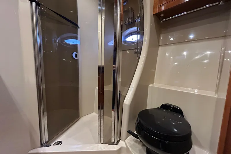  Yacht Photos Pics Luxurious bathroom in 2003 Cruisers Yachts 540 Express with shower and toilet.
