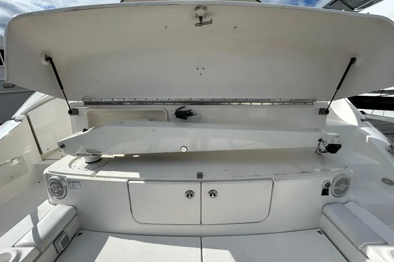 1000 Hour Service Completed Yacht Photos Pics 2003 Cruisers Yachts 540 Express boat interior with open storage compartment.