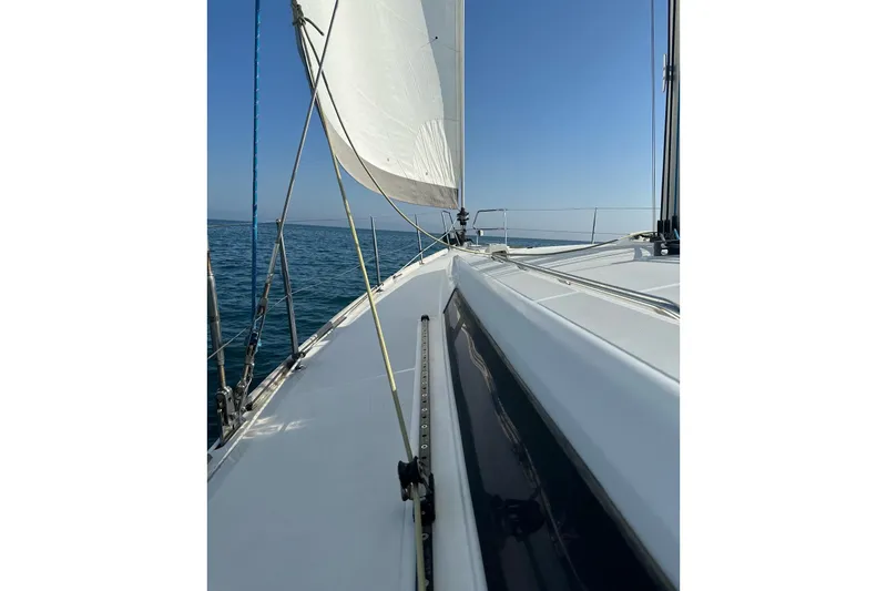 Margaret Yacht Photos Pics 2014 Beneteau Oceanis 48 sailing on open sea under clear blue sky.