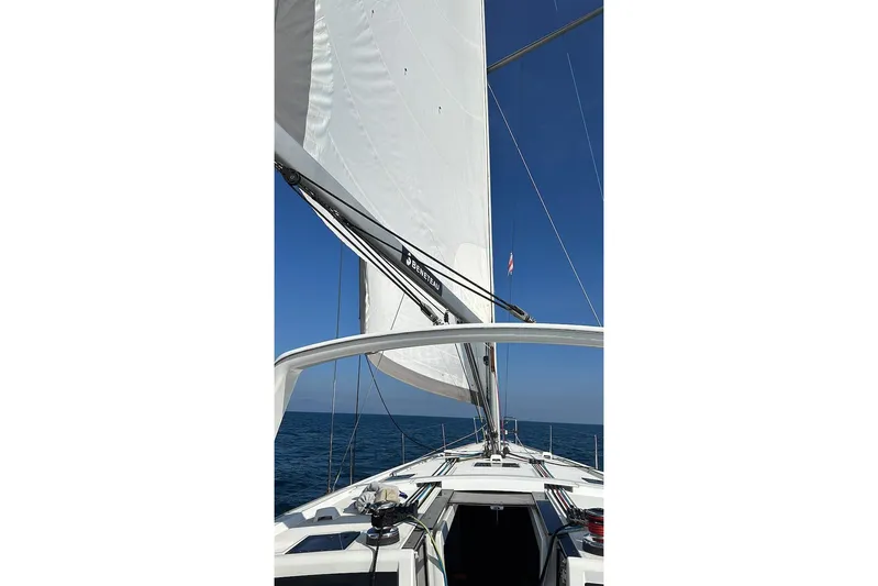 Margaret Yacht Photos Pics 2014 Beneteau Oceanis 48 sailboat on open sea under clear blue sky.