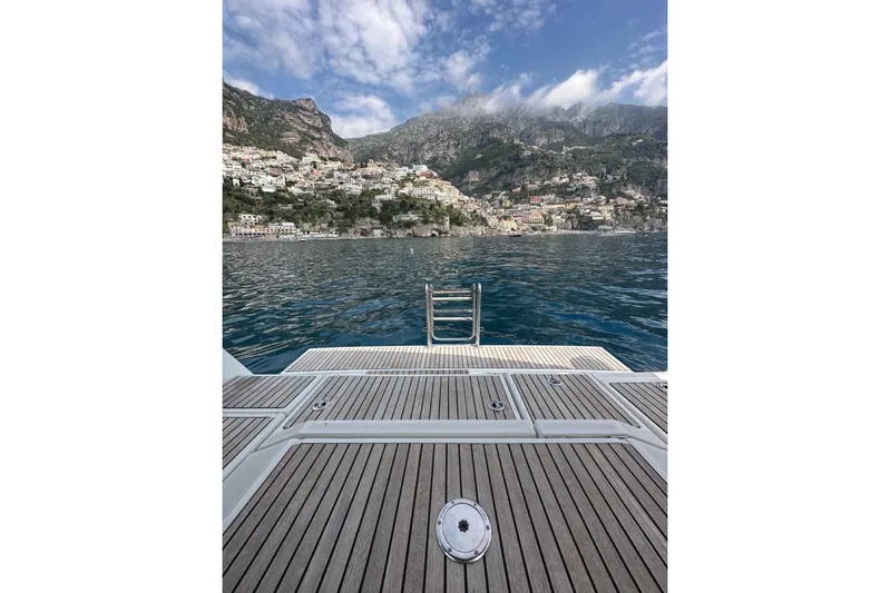 Margaret Yacht Photos Pics Beneteau Oceanis 48 yacht deck overlooking scenic coastal town and mountains, 2014 model.