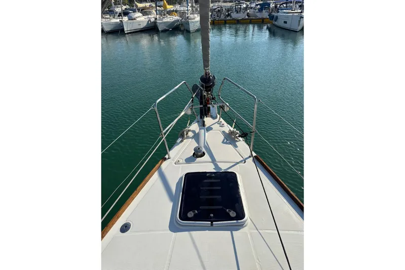 Margaret Yacht Photos Pics Bow view of 2014 Beneteau Oceanis 48 sailboat docked in marina.