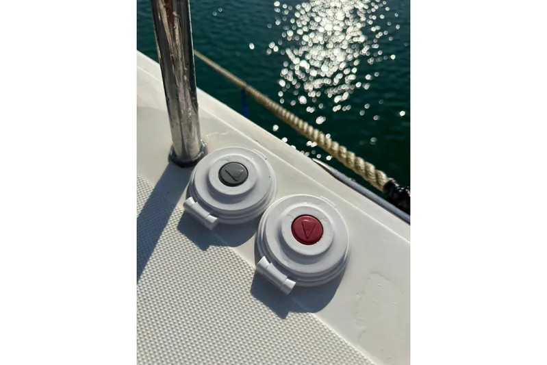 Margaret Yacht Photos Pics Deck controls on a 2014 Beneteau Oceanis 48 yacht, with sparkling water in the background.