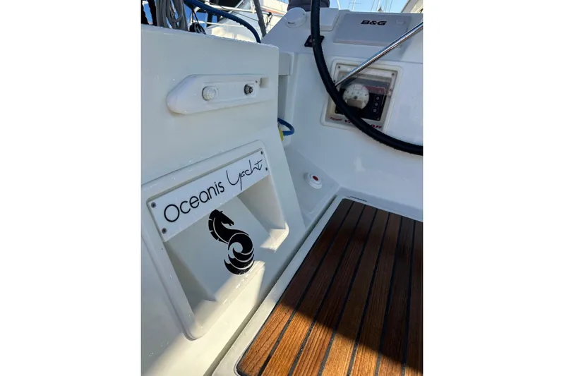 Margaret Yacht Photos Pics Beneteau Oceanis 48 yacht cockpit, 2014 model, featuring teak flooring and control panel.
