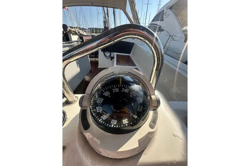 Margaret Yacht Photos Pics 2014 Beneteau Oceanis 48 yacht compass and helm, showcasing sleek design and navigation features.