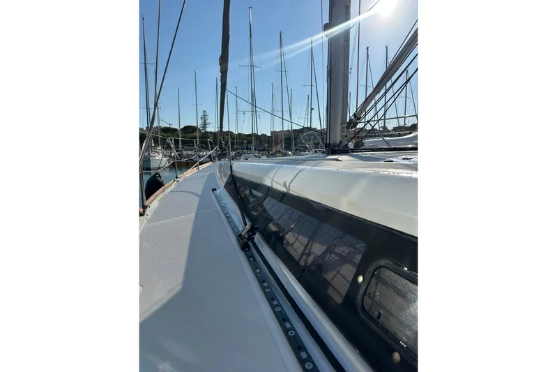 Margaret Yacht Photos Pics 2014 Beneteau Oceanis 48 sailboat deck view in marina, sunny day.