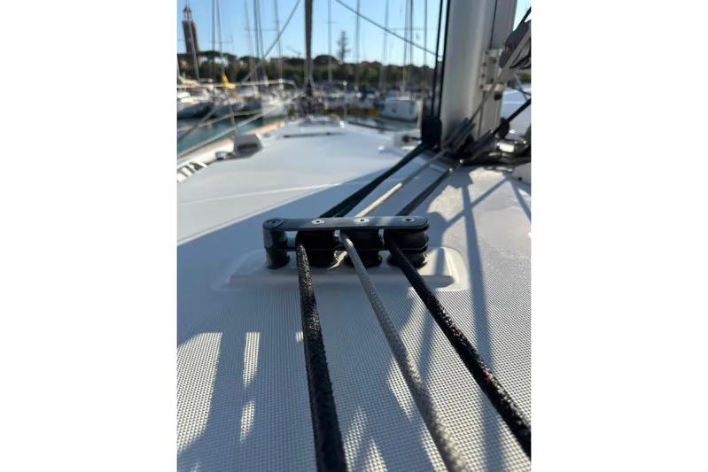 Margaret Yacht Photos Pics 2014 Beneteau Oceanis 48 sailboat deck with rigging and ropes in marina.