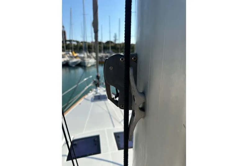 Margaret Yacht Photos Pics Close-up of a 2014 Beneteau Oceanis 48 sailboat mast and rigging in a marina.