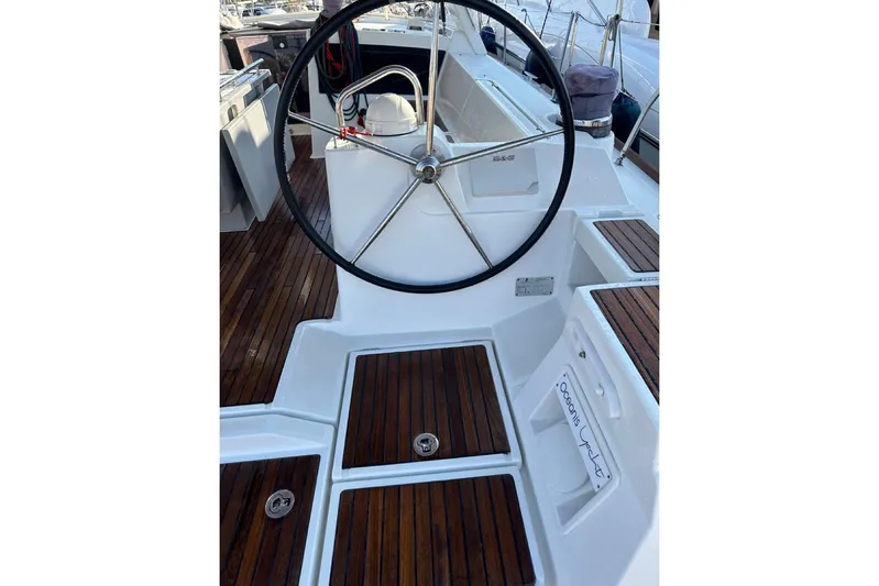 Margaret Yacht Photos Pics 2014 Beneteau Oceanis 48 yacht cockpit with wooden flooring and steering wheel.