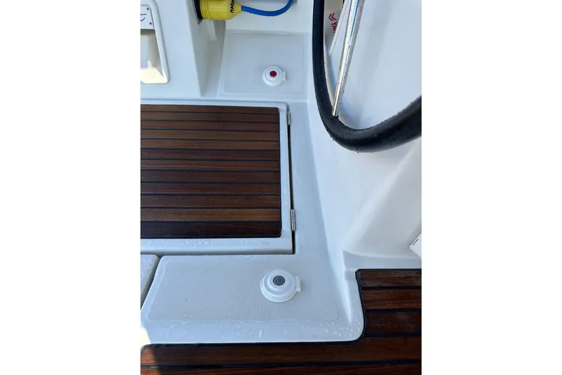 Margaret Yacht Photos Pics Teak deck detail on 2014 Beneteau Oceanis 48 sailboat, featuring hatch and fittings.